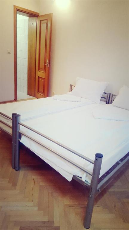 Postel nebo postele na pokoji v ubytování Sleep Inn Hostel