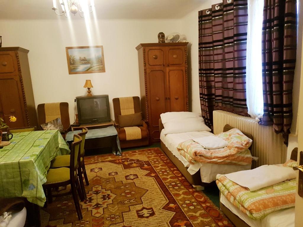 Postel nebo postele na pokoji v ubytování Kúti Vendégház