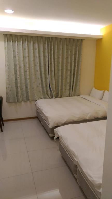 Postel nebo postele na pokoji v ubytování Galaxy Mini Inn