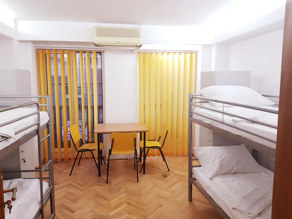 Postel nebo postele na pokoji v ubytování Sleep Inn Hostel