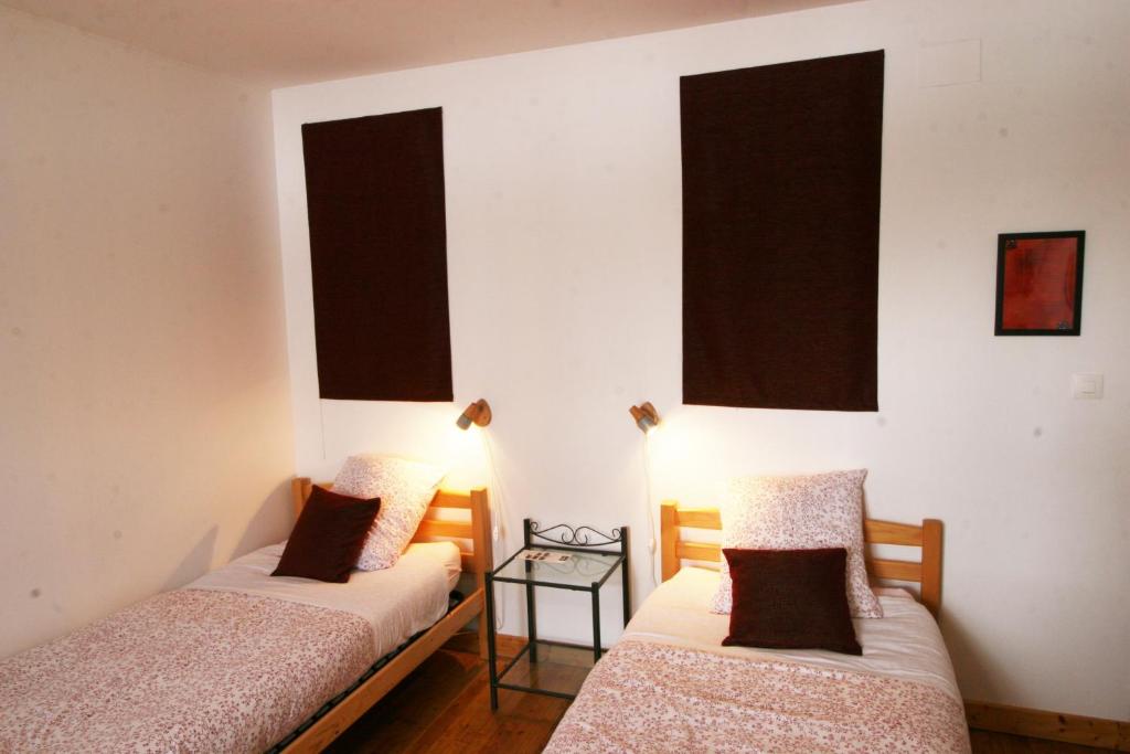Postel nebo postele na pokoji v ubytování Le Clos Auvergnat