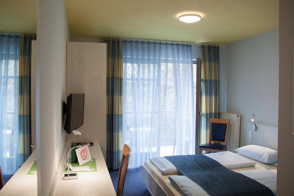 Postel nebo postele na pokoji v ubytování Pension Vicus