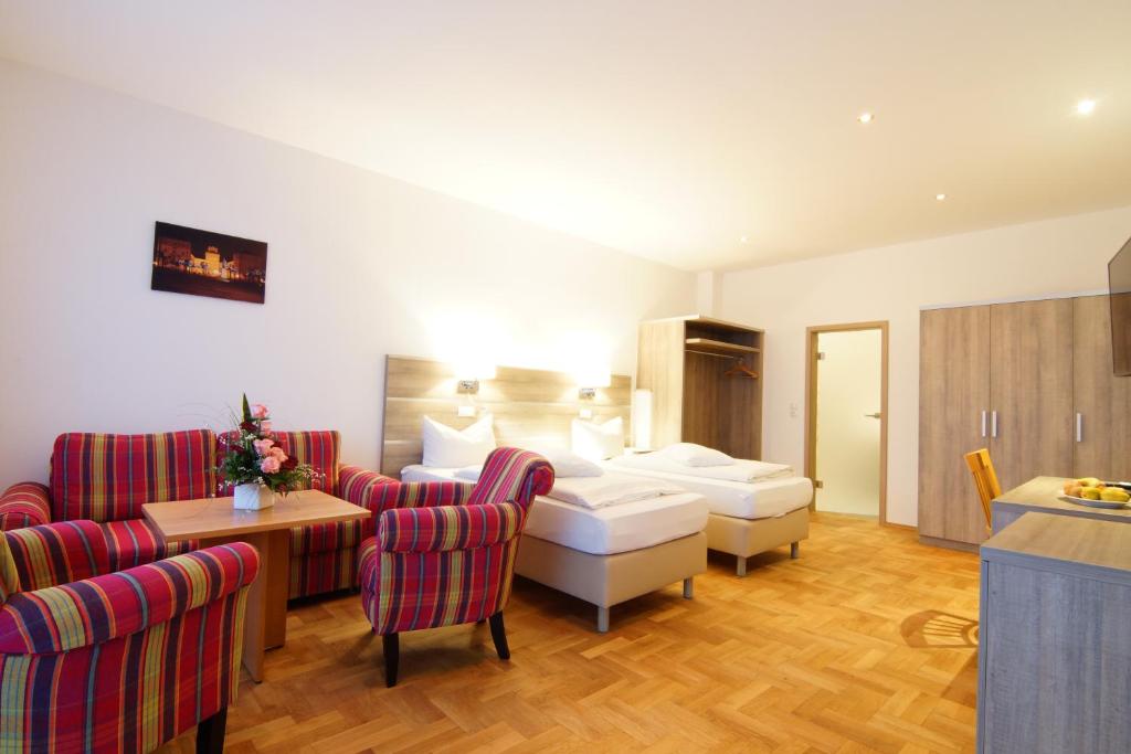 Postel nebo postele na pokoji v ubytování Hotel Spitzenpfeil