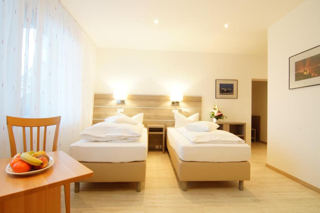 Postel nebo postele na pokoji v ubytování Hotel Spitzenpfeil