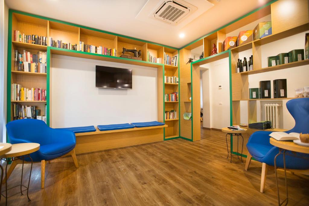 TV a/nebo společenská místnost v ubytování La Gustea Hotel & Cucina
