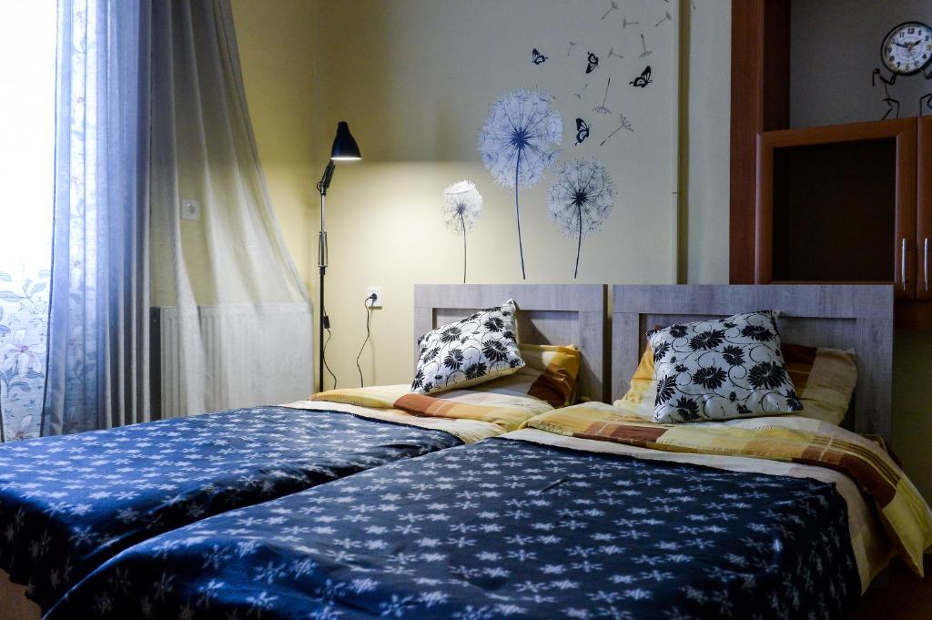 Postel nebo postele na pokoji v ubytování Nana's Home