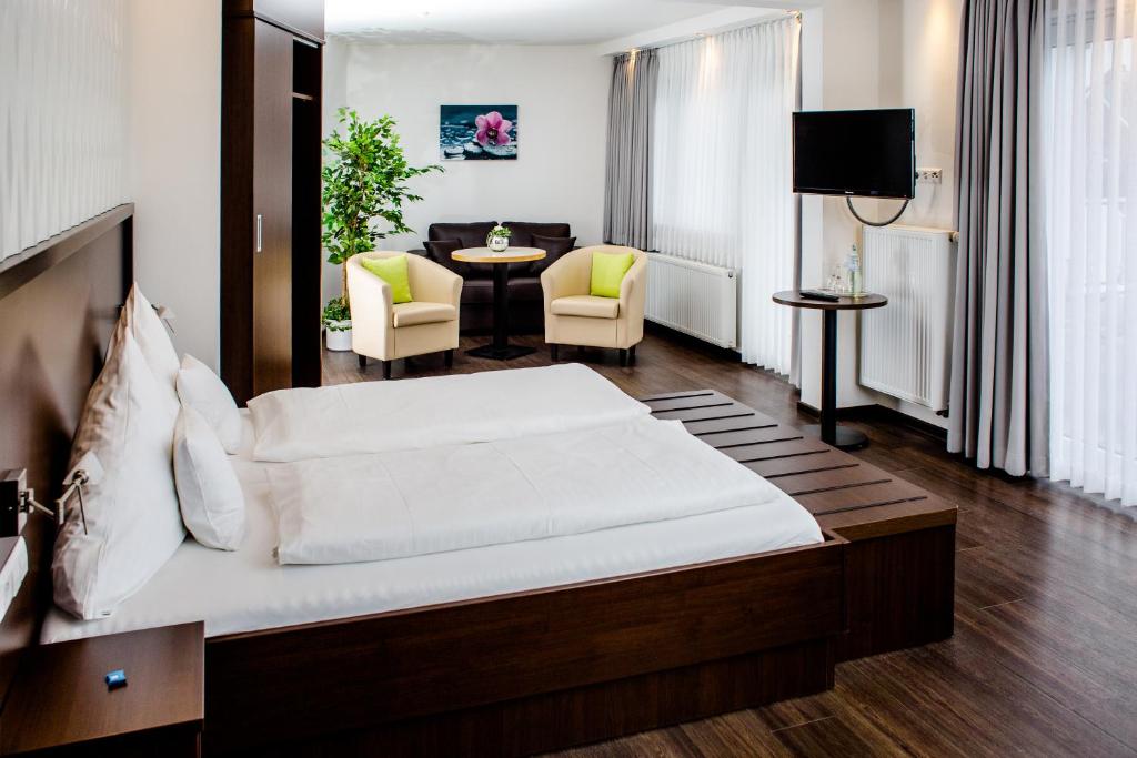Postel nebo postele na pokoji v ubytování Hotel Bolte