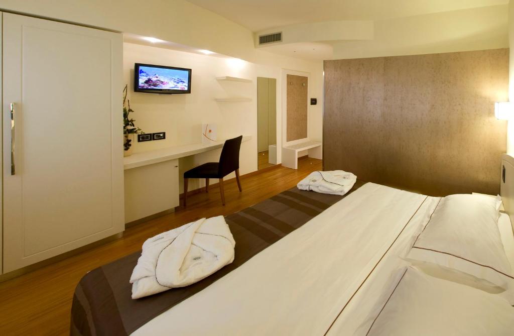 Postel nebo postele na pokoji v ubytování Hotel Napoleon