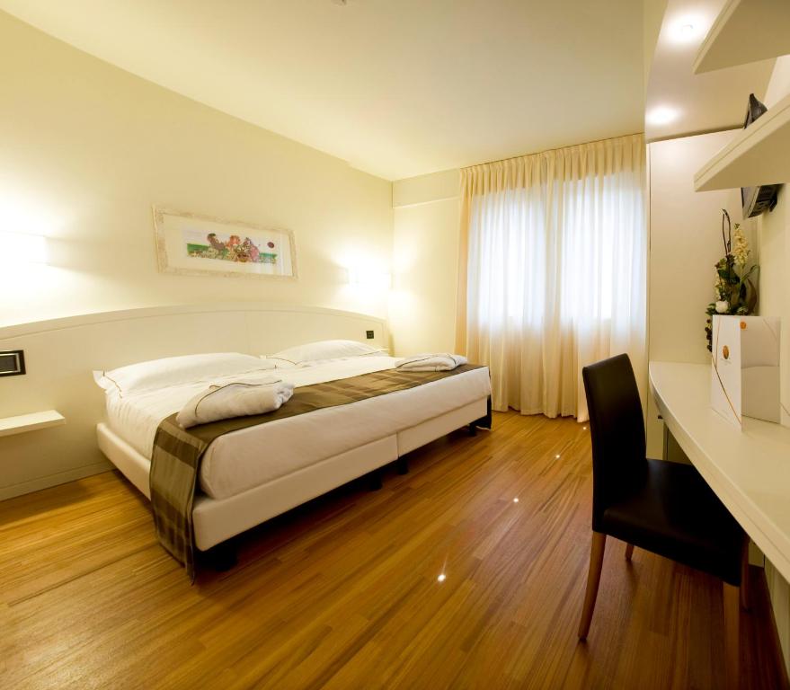 Postel nebo postele na pokoji v ubytování Hotel Napoleon
