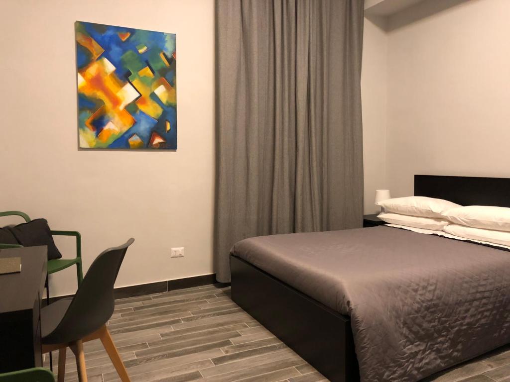 Postel nebo postele na pokoji v ubytování Caio Duilio B&B