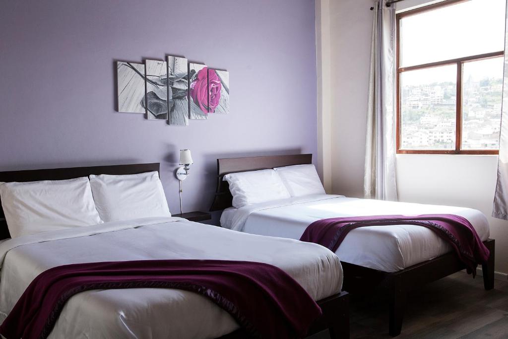 Postel nebo postele na pokoji v ubytování Hotel Colonial San Agustin