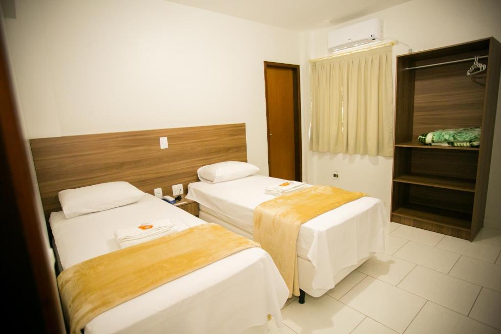 Postel nebo postele na pokoji v ubytování Hotel Folley