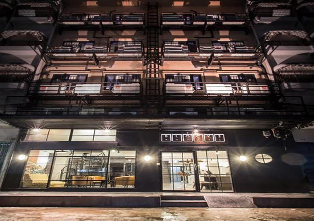 an overhead view of a building at night at The Blocks Hostel Sukhumvit 10 in Bangkok