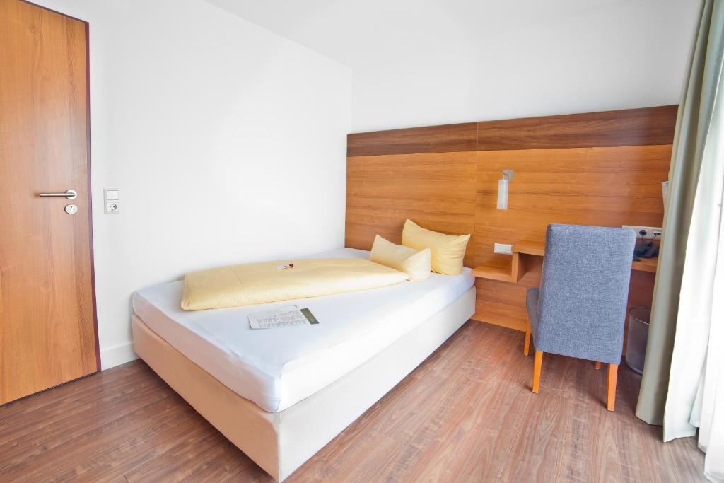 Postel nebo postele na pokoji v ubytování allgovia hotel garni