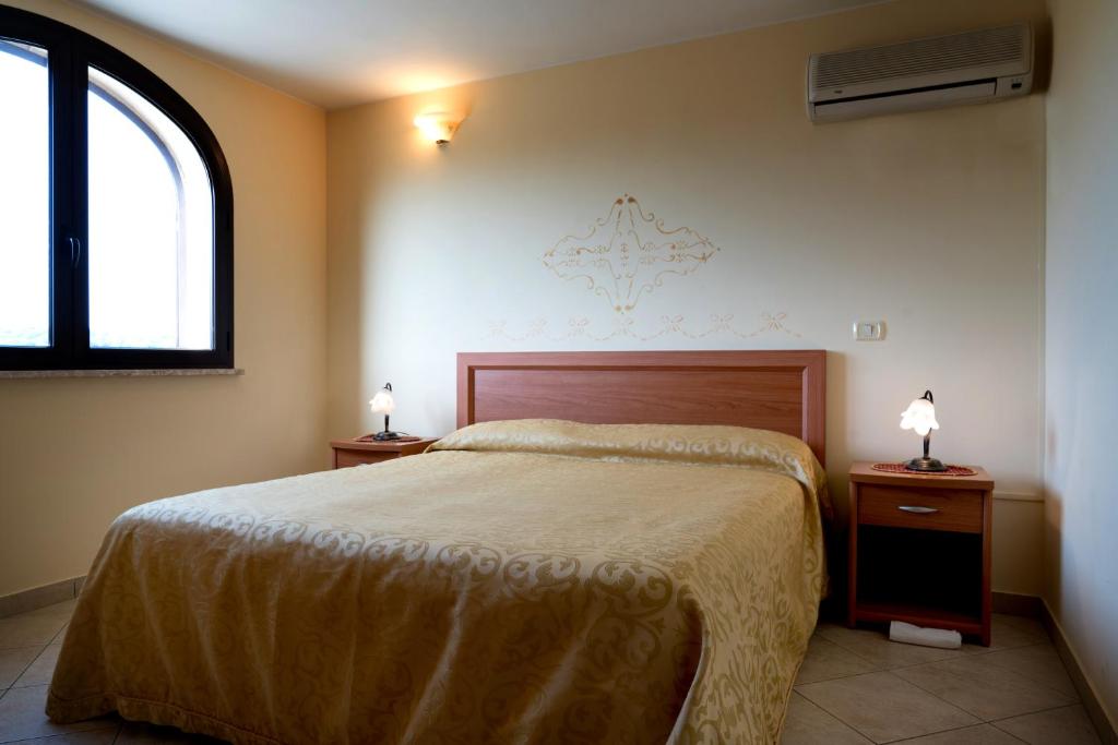 Postel nebo postele na pokoji v ubytování Hotel Salento