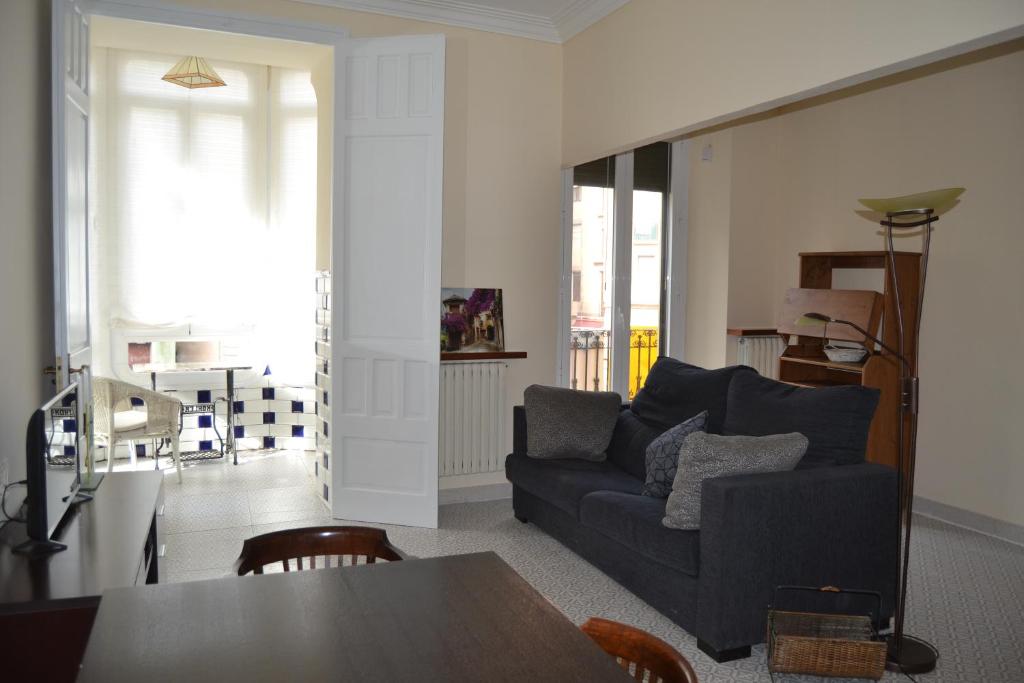 a living room with a couch and a table at Placido Apartment in Manresa