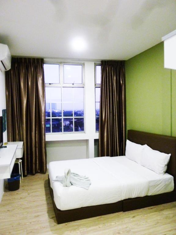 Postel nebo postele na pokoji v ubytování The b'Hotel