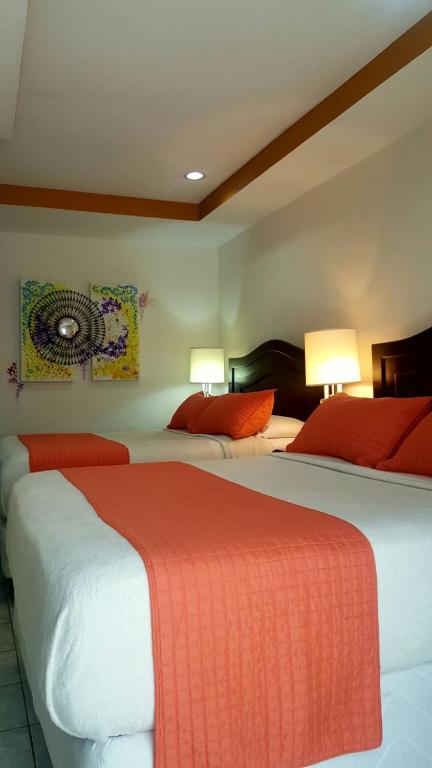 Postel nebo postele na pokoji v ubytování Hotel Verona