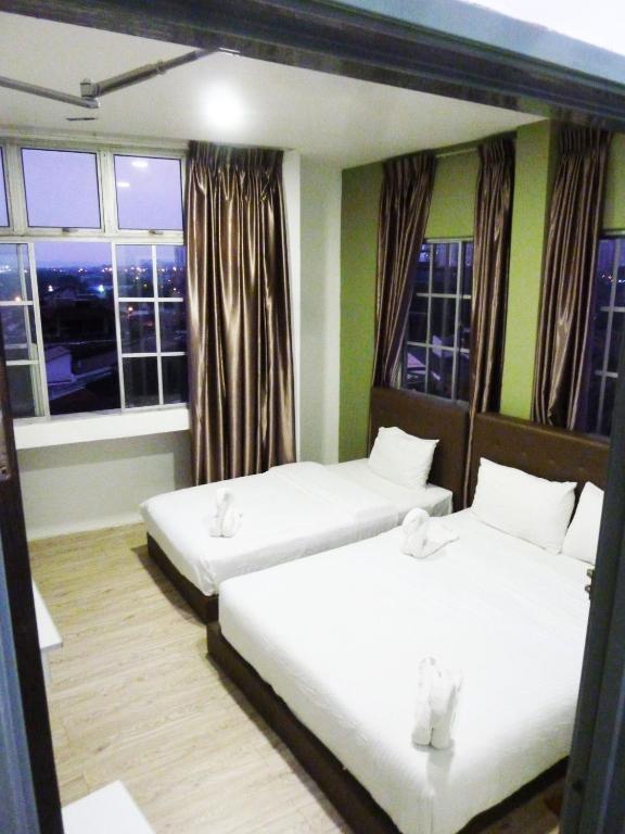 Postel nebo postele na pokoji v ubytování The b'Hotel