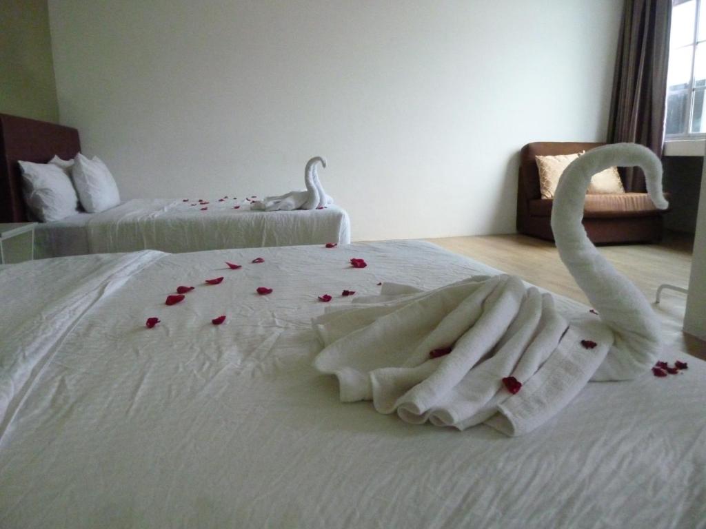 Postel nebo postele na pokoji v ubytování The b'Hotel