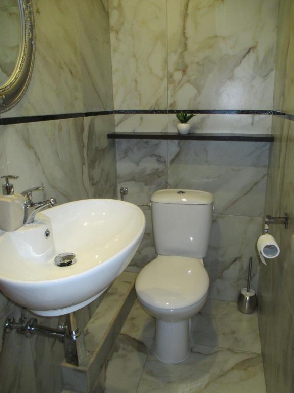 A bathroom at Genex Apartment