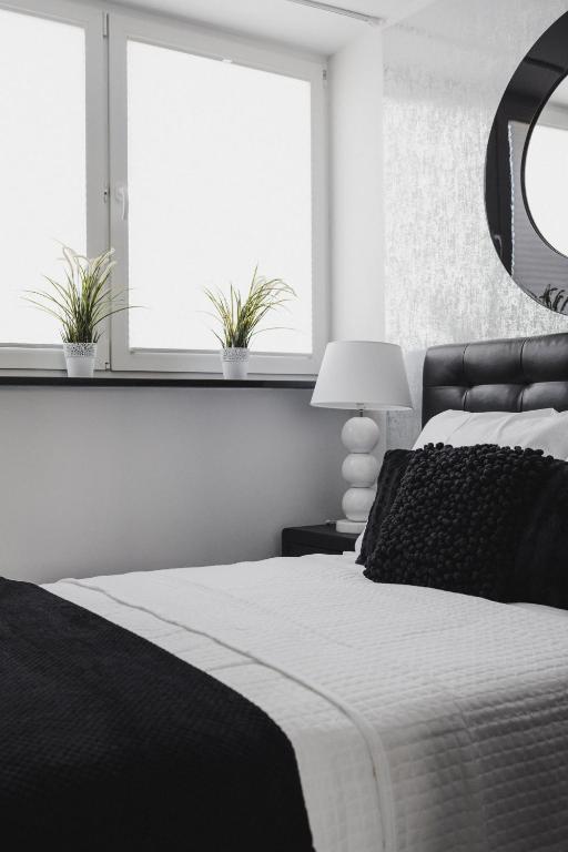 Posteľ alebo postele v izbe v ubytovaní Grodzka Apartament Centrum
