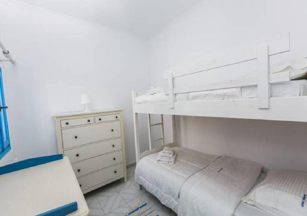 Postel nebo postele na pokoji v ubytování GeoMare Beach House