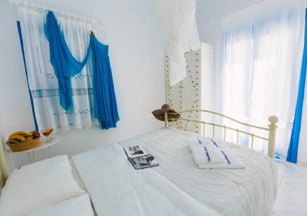 Postel nebo postele na pokoji v ubytování GeoMare Beach House