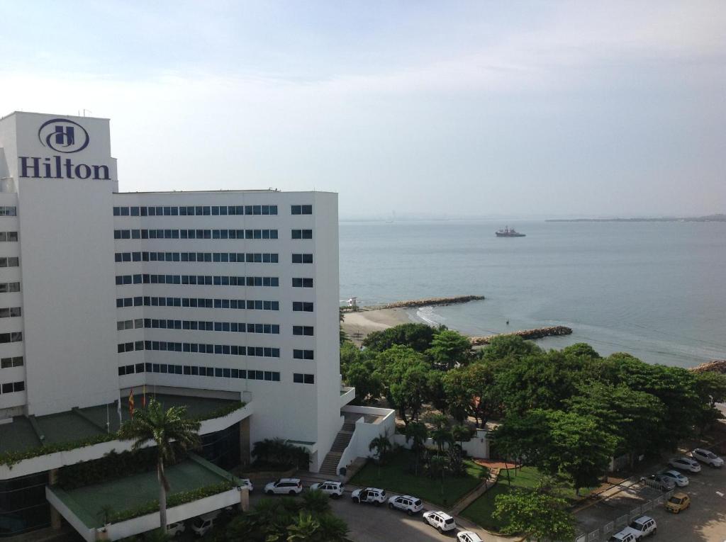 a building in front of a body of water at Apartamentos Cartagena in Cartagena de Indias
