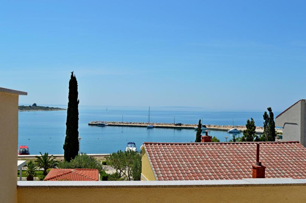 a view of the ocean from a building at Apartmani Mačak II in Novalja