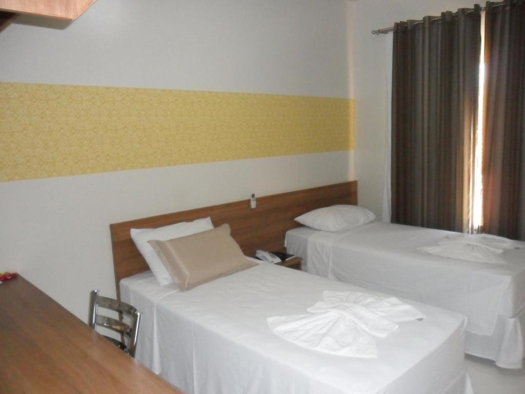 Postel nebo postele na pokoji v ubytování Hotel LG