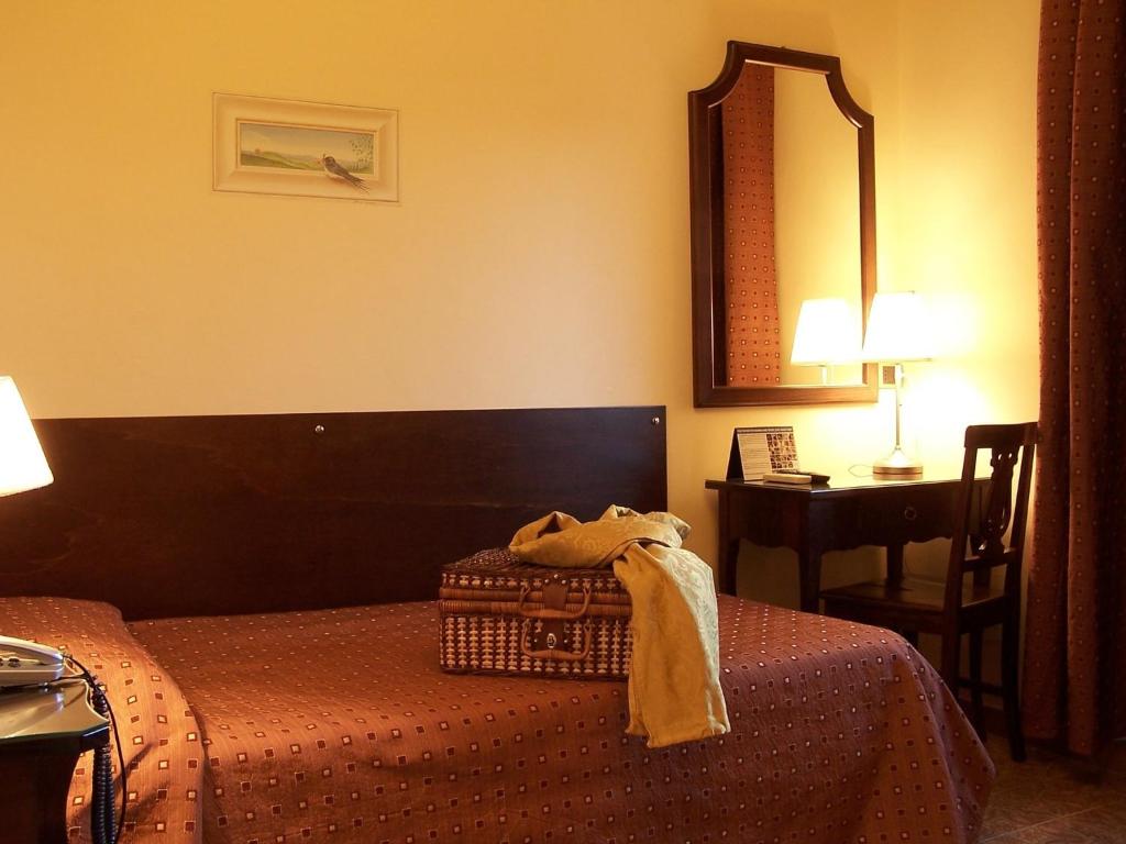 Postel nebo postele na pokoji v ubytování Hotel La Pace - Experience