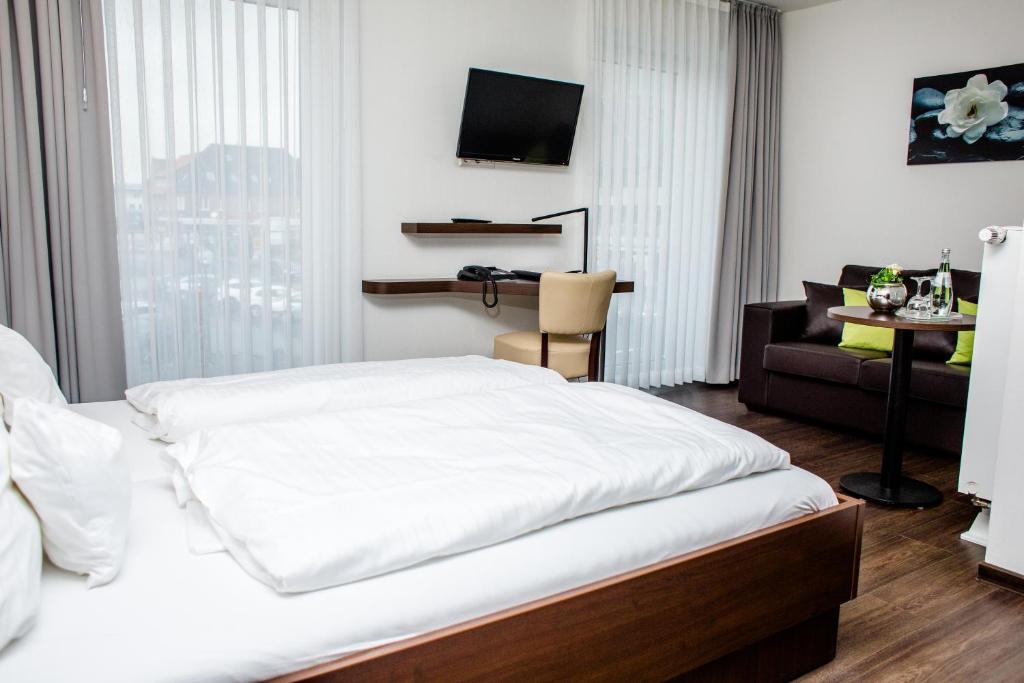 Postel nebo postele na pokoji v ubytování Hotel Bolte
