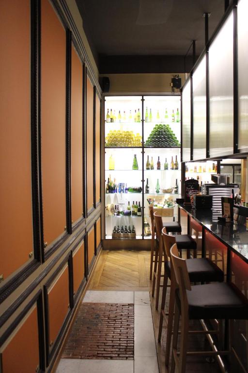 a restaurant with a bar and some chairs and windows at Castel de Pont-a-Lesse in Dinant