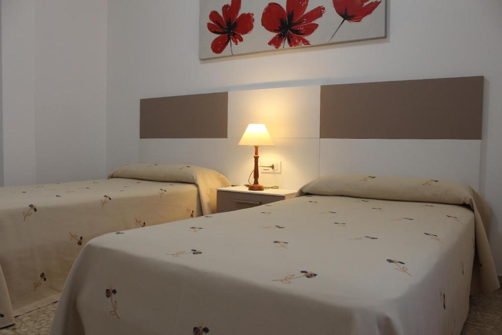 Postel nebo postele na pokoji v ubytování Apartamentos Solmar