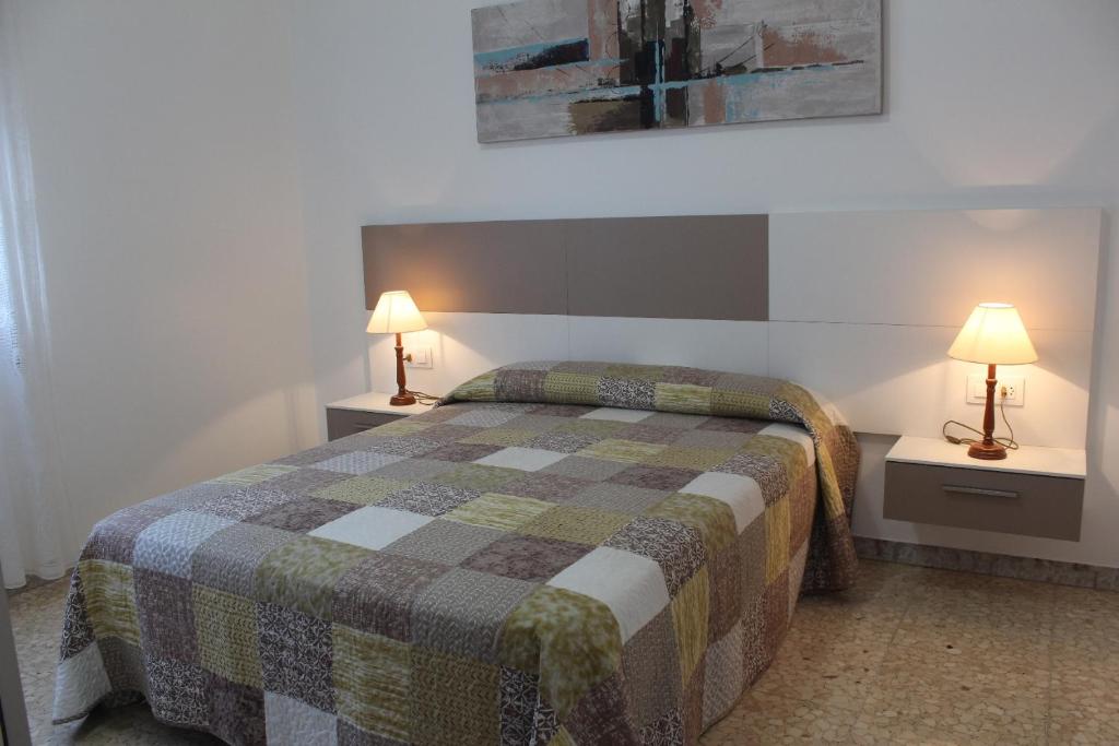 Postel nebo postele na pokoji v ubytování Apartamentos Solmar
