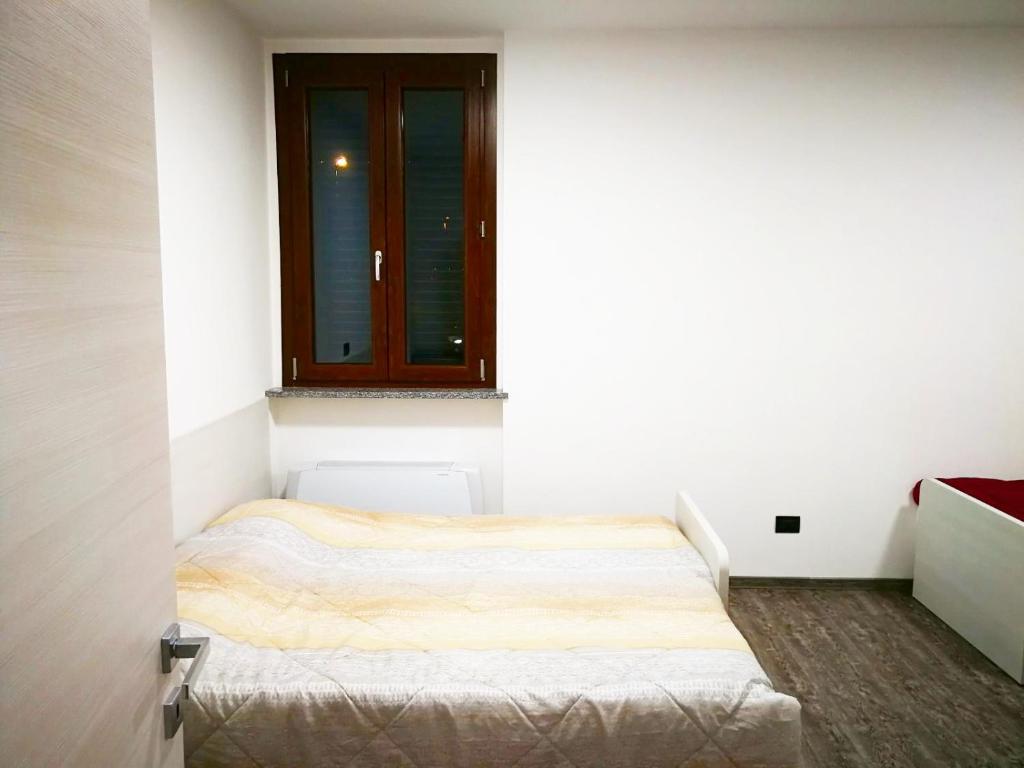 Postel nebo postele na pokoji v ubytování Residenza Borgazzi CIR S00031