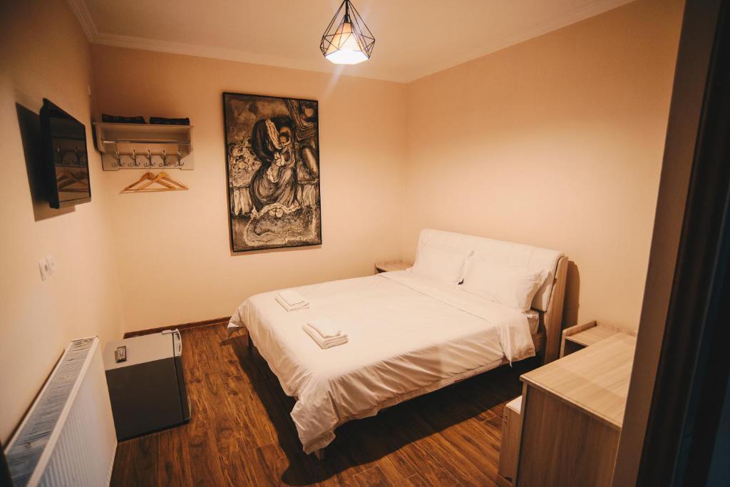 Postel nebo postele na pokoji v ubytování Hotel Sani Kutaisi