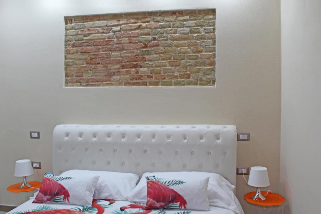 Łóżko lub łóżka w pokoju w obiekcie Flamingo Luxury Apartment AJPSARDINIA