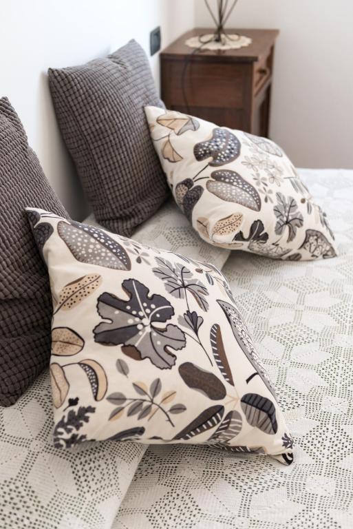 two pillows sitting on top of a bed at Agriturismo AgrileisureTime in Spoleto