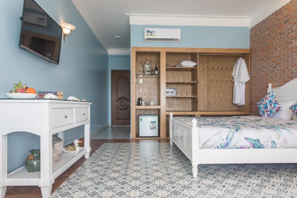 Giường trong phòng chung tại Grace Boutique Resort