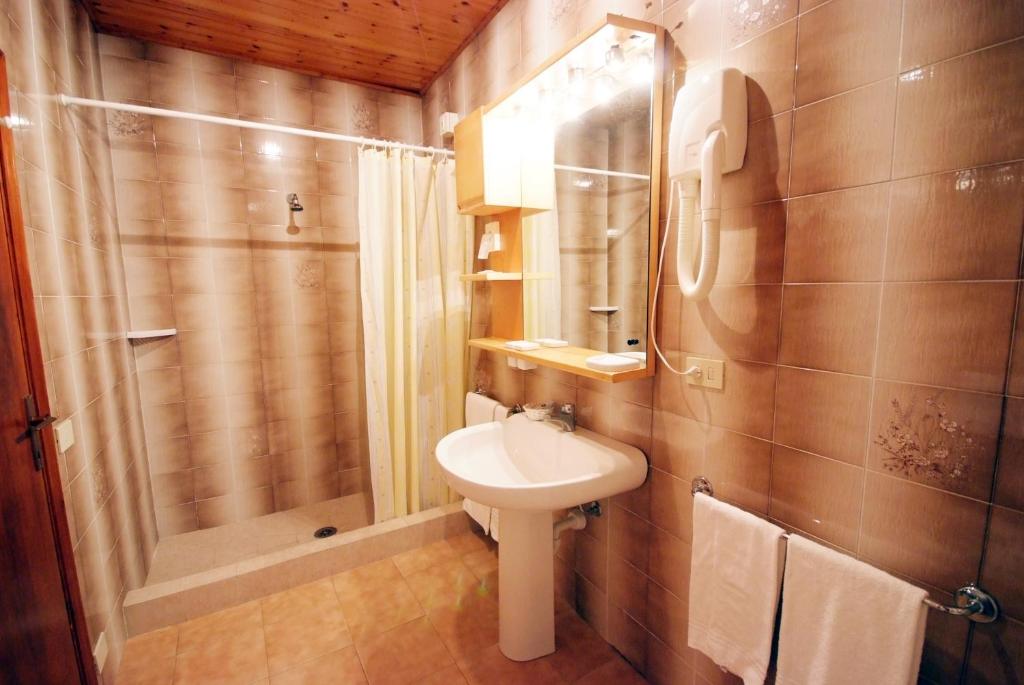 Ein Badezimmer in der Unterkunft Hotel La Stella