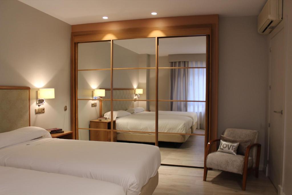 
Un ou plusieurs lits dans un hébergement de l'établissement Hotel Carreño
