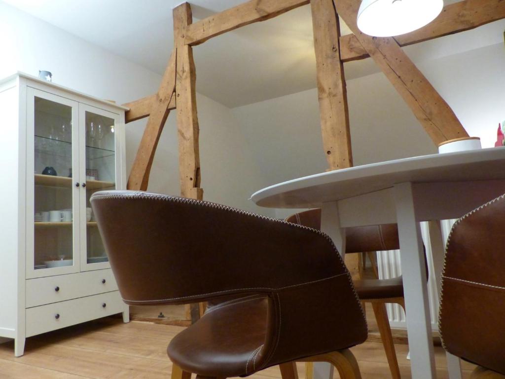 a dining room with a table and a chair at Altstadt Soest in Soest