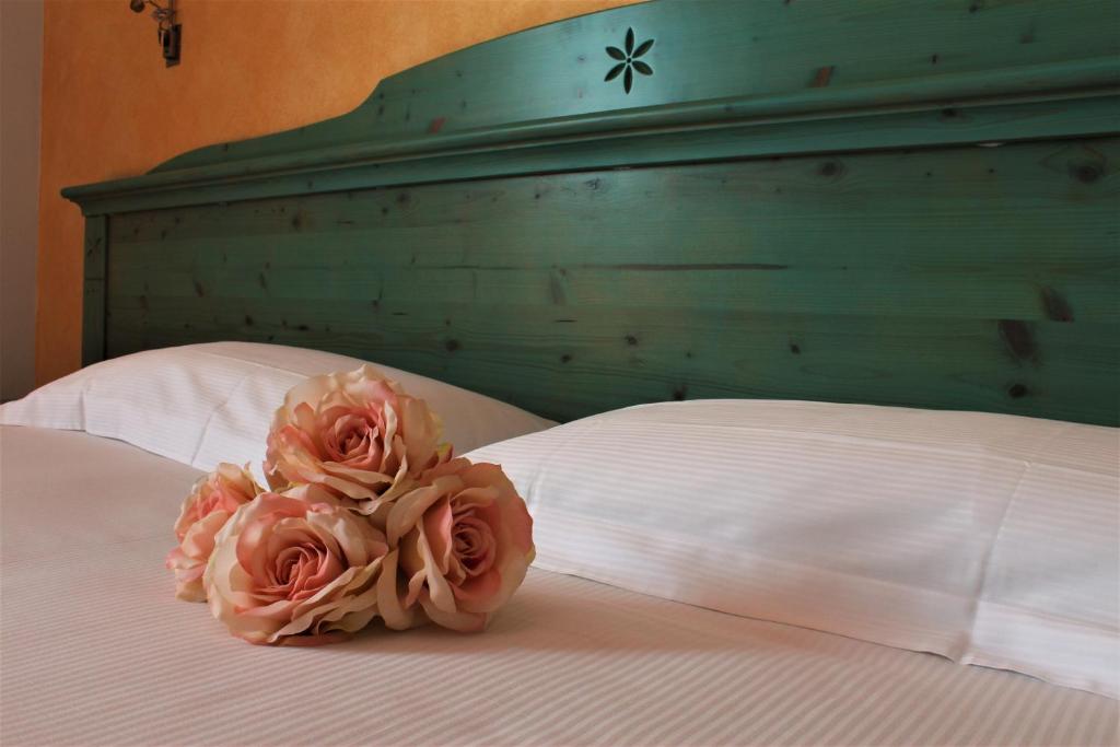 Postel nebo postele na pokoji v ubytování Hotel Residence Montelago