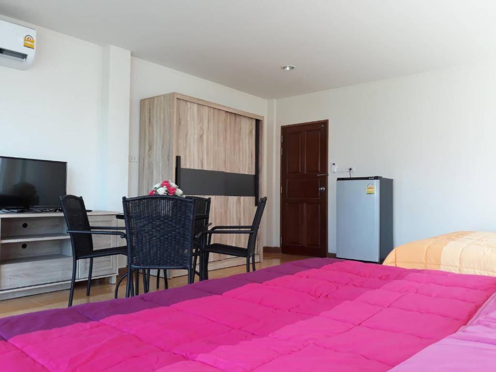 Postel nebo postele na pokoji v ubytování Uncle House Krabi