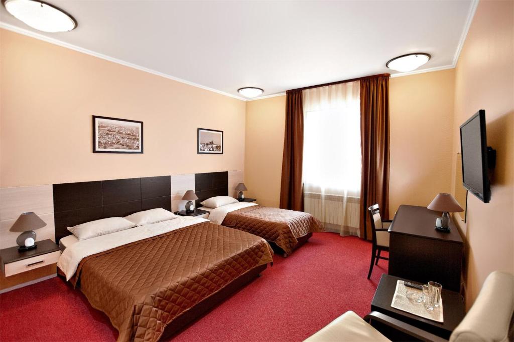 Säng eller sängar i ett rum på Park Hotel Praga