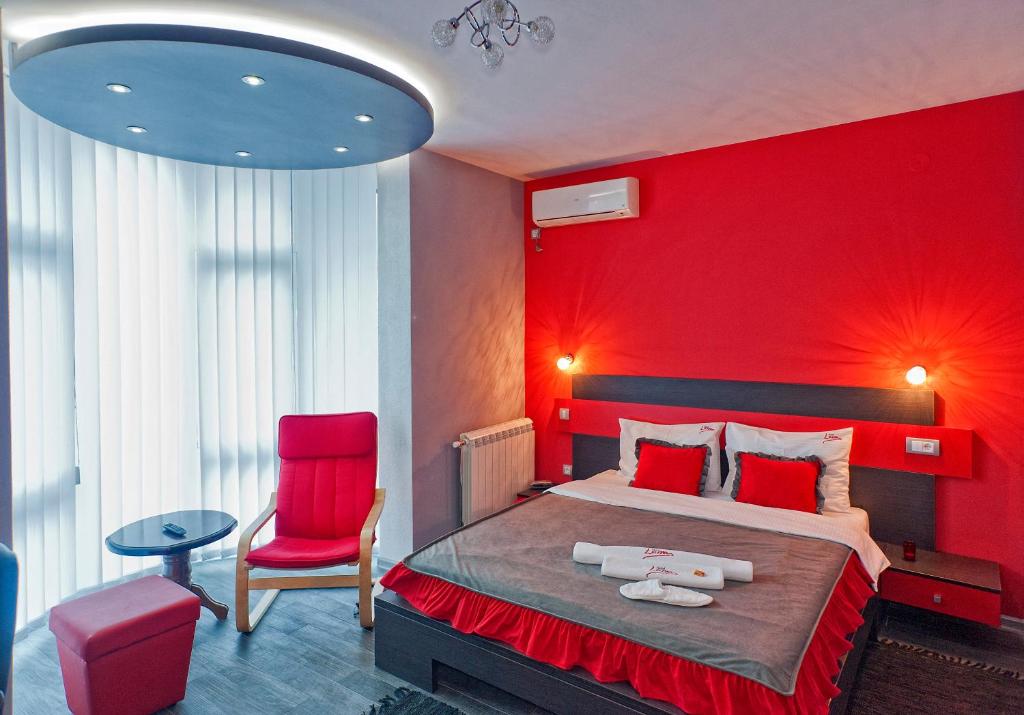 Postel nebo postele na pokoji v ubytování Garni Hotel Lama