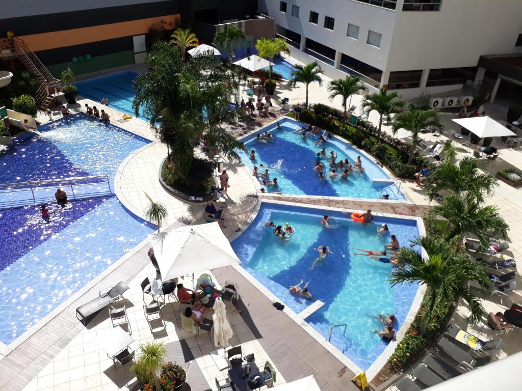 an overhead view of two pools with people in them at Veredas Flat 325 in Rio Quente