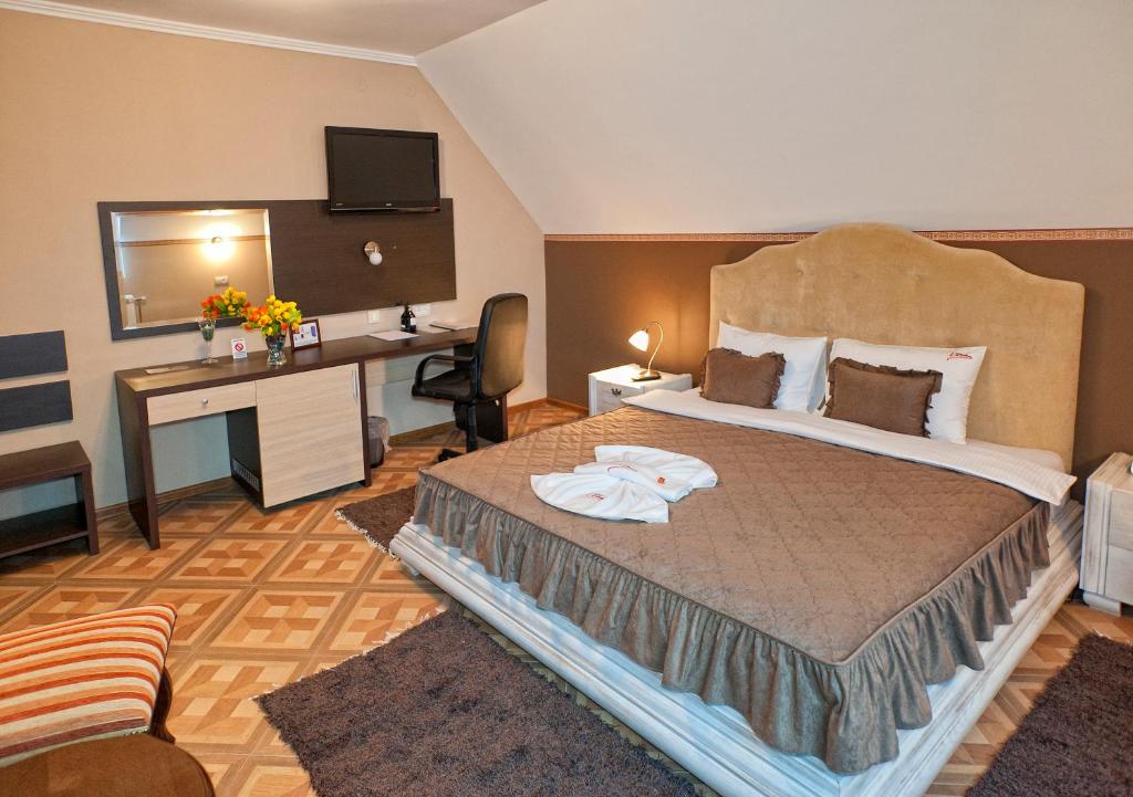 Postel nebo postele na pokoji v ubytování Garni Hotel Lama